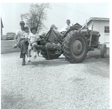 Dad-and-kids-on-Ford-1962.jpg